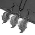 Detail view of black feather-shaped jewelry set with intricate hollowed textures and matte finish - Black Set
