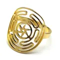 Detail view of gold stainless steel ring with circular hollow star pattern and maze lines - Adjustable Open / Gold