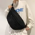 Large black corduroy crossbody bag with vintage ribbed texture and zipper closure - Black
