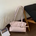 Borsa tote in pelle cerata rosa chiaro con pieghe, fibbia e tracolla regolabile - Rosa