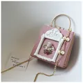 Detail of vintage dusty pink square bag with baroque angel relief and pearl chain strap - Angel Version / Pink