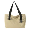 Beige canvas tote bag with black wide straps and stylish graphic print on the front - Khaki