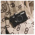 Unique camera-shaped crossbody bag in black glitter with gold chain strap - Black
