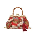 Red Chinese crane print handbag with bamboo handle, gold chain and silk tassel - Red