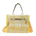 Yellow transparent mesh tote bag with white TOTE BAG lettering and orange shoulder strap - Yellow