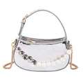 Metallic silver mini bag featuring pearl and silver heart charms with a gold chain strap - Silver