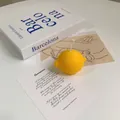 Realistic yellow lemon scented soy wax candle for home decor and creative photo props - Lemon