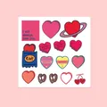 Flat lay of pink and red heart stickers with romantic quotes for notebooks and journals - Heart And Bakery Theme
