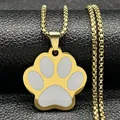 Macro view of gold stainless steel cat paw pendant with white enamel on a black leather display - Box Chain / Gold A (White Paw)