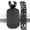 Detail view of black stainless steel dog tag pendant with geometric laser-cut patterns - Black