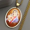 Detailed close-up of golden oval Saint Mary pendant necklace with colorful religious art - Gold