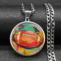 Detailed view of an American football art pendant on a silver-toned Cuban link chain necklace - 60CM / Silver