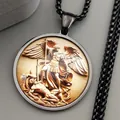 Macro shot of Archangel St. Michael embossed gold pendant with black chain detail - Black