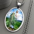 Saint Jude oval pendant necklace with colorful religious imagery on silver metal chain - Silver