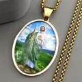 Close-up of golden Saint Jude pendant with colorful religious figure and box chain - Gold