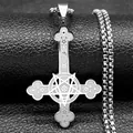 Macro detail of silver gothic inverted cross pendant with pentagram and floral textures - Silver
