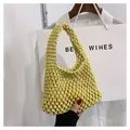 Detail of a bright yellow hand-woven cotton rope mesh bag with a hollow hollow-out design - Yellow