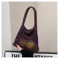 Detail of purple handmade crochet tote bag featuring thick woven mesh and lemon accents - Purple
