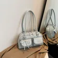 Light blue patent leather shoulder bag with double pockets and pearl bow charm detail - Silver