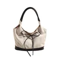 Bolso tote de lona crema con ribete de cuero negro y detalle de lazo elegante - Blanco Roto