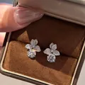 Sparkling flower petal stud earrings with round brilliant cut stones in silver finish - Three-Leaf Clover Studs (ED211)
