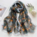 Lightweight navy blue silk scarf with vibrant orange floral print for beach sun protection - Quicksand Rose Mountain Teal