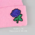 Pink knitted beanie with blue rose embroidery patch and fine floral texture detail - Blue Rose (GZ-4448)