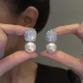 Silver drop earrings featuring a square rhinestone stud and a round white pearl pendant - Silver Square Brick Pearl Earring Post Style (E7058)