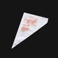 Set of 100 disposable piping bags for cake decorating and cream squeezing tasks. - Small