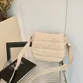 Minimalist cream-colored quilted crossbody bag with adjustable wide strap and parallel stitching - Light Khaki