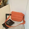 Quilted crossbody bag in caramel finish with padded texture and wide strap - Brown