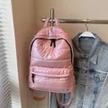 Pink quilted down nylon backpack with metallic finish for women showing the front view - Pink