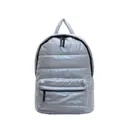 Light blue quilted puffer backpack with metallic finish and spacious compartments - Blue