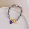 18K gold plated OT clasp bracelet with purple heart charm and freshwater pearl - Purple