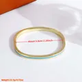 Brazalete de cobre bañado en oro de 18K con esmalte azul claro y cierre de bisagra - Azul claro
