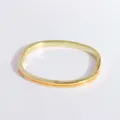 Detail of 18K gold-plated hinged bangle featuring a polished orange enamel inlay - Orange