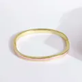 18K gold plated bangle with pink enamel stripes and a secure hinge closure - Pink