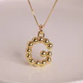 18K gold plated letter G necklace with polished balloon bubble design and gold bead surface - Letter G