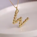18K gold plated letter W pendant necklace with round bead texture on a fine gold chain - Letter W
