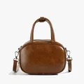 Deep brown oil wax leather crossbody handbag with silver hardware and top handles - Brown