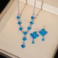 Parure de bijoux en argent avec zircons carrés bleu clair comprenant collier et boucles - Style Carré Bleu Mer (PJ--1)