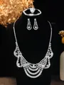 Detail shot of shimmering bridal jewelry set with crystal necklace and earrings - Silver Multi-Layer Wave Necklace Earrings Ring Bracelet Set (PJ--T0261)