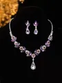 Elegant purple crystal flower necklace and earring set on a premium black bust - Purple Floral Water Drop Necklace Earrings Set (PJ--T0206)