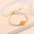 Elegant gold flower bracelet with sparkling zircons and adjustable pull chain closure - Zirconia Rotating Flower Bracelet (TS0195)