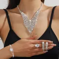 Elegant silver bridal jewelry set with sparkling crystals for weddings and formal events - Silver V-Shaped Tassel Large Necklace Bracelet Earrings Ring Set (PJ--T0271)