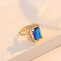 Vintage gold adjustable ring with emerald-cut blue sapphire and white diamond halo - Ring / Blue