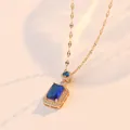 Elegant gold necklace with royal blue zircon pendant set in polished titanium steel - Necklace / Blue