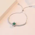 Snowflake silver adjustable bracelet with green micro-pave crystals on white stand - Emerald Snowflake Bracelet