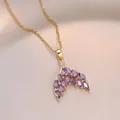 Elegant gold necklace featuring a fishtail pendant with purple marquise-cut stones - Gold Purple Mermaid Tail (X1476) / Gold