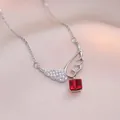 Elegant angel wing necklace with sparkling red square gemstone and tassels on champagne silk - Red Wing (X1425)